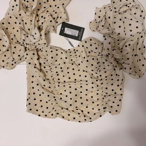 Polka dot top from pretty little things.